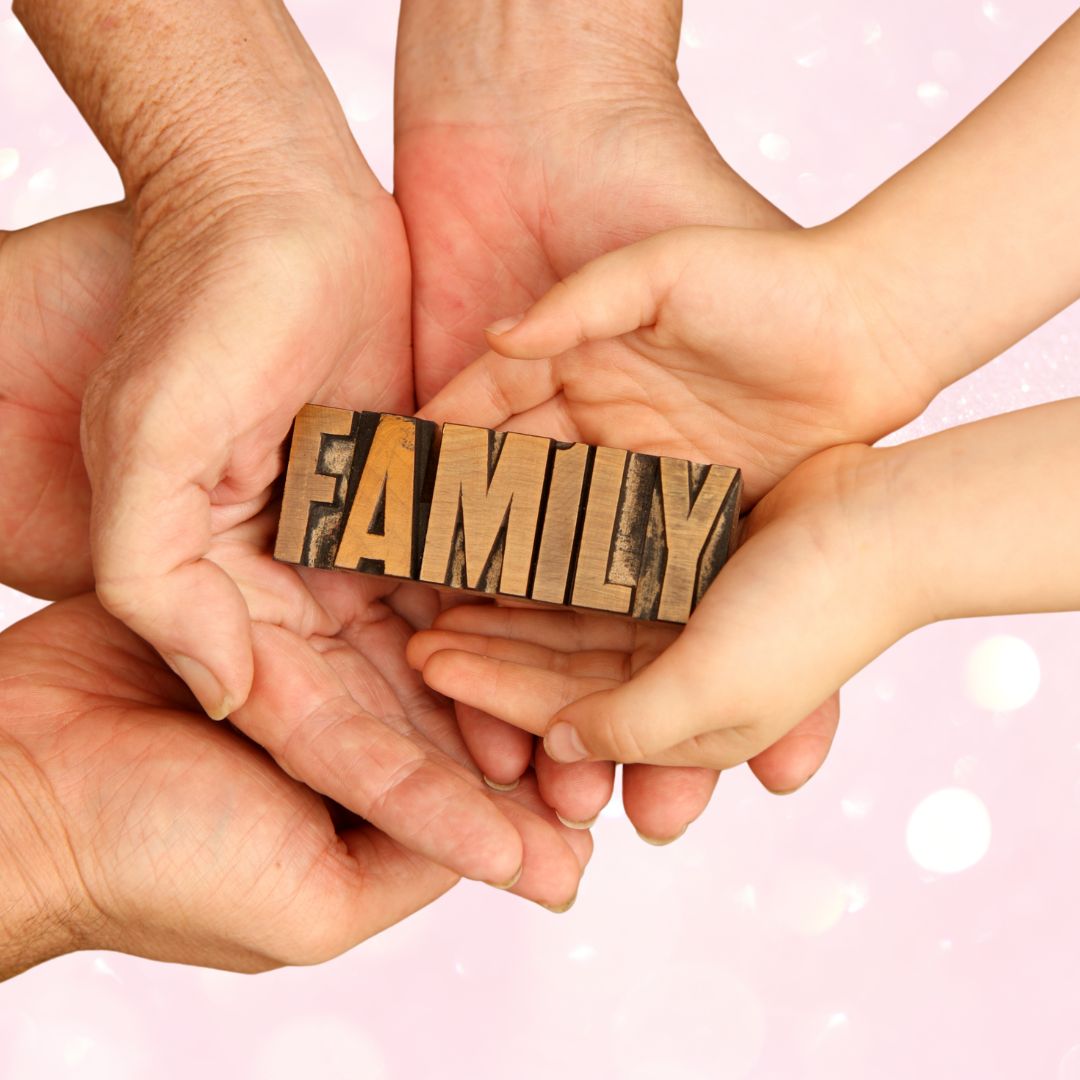 The word family in the middle of different sized hands